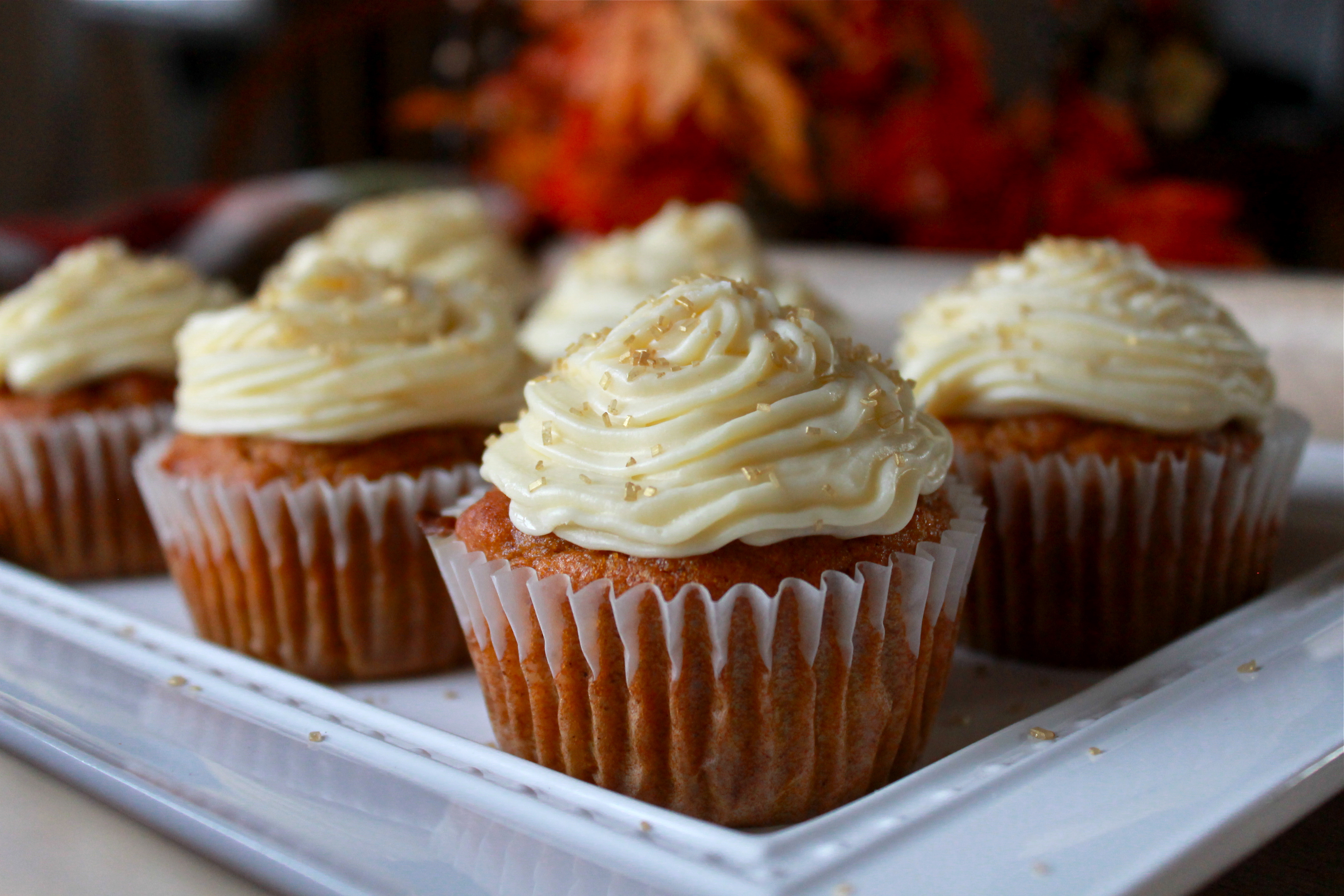 Pumpkin cupcakes with butter cream cheese frosting