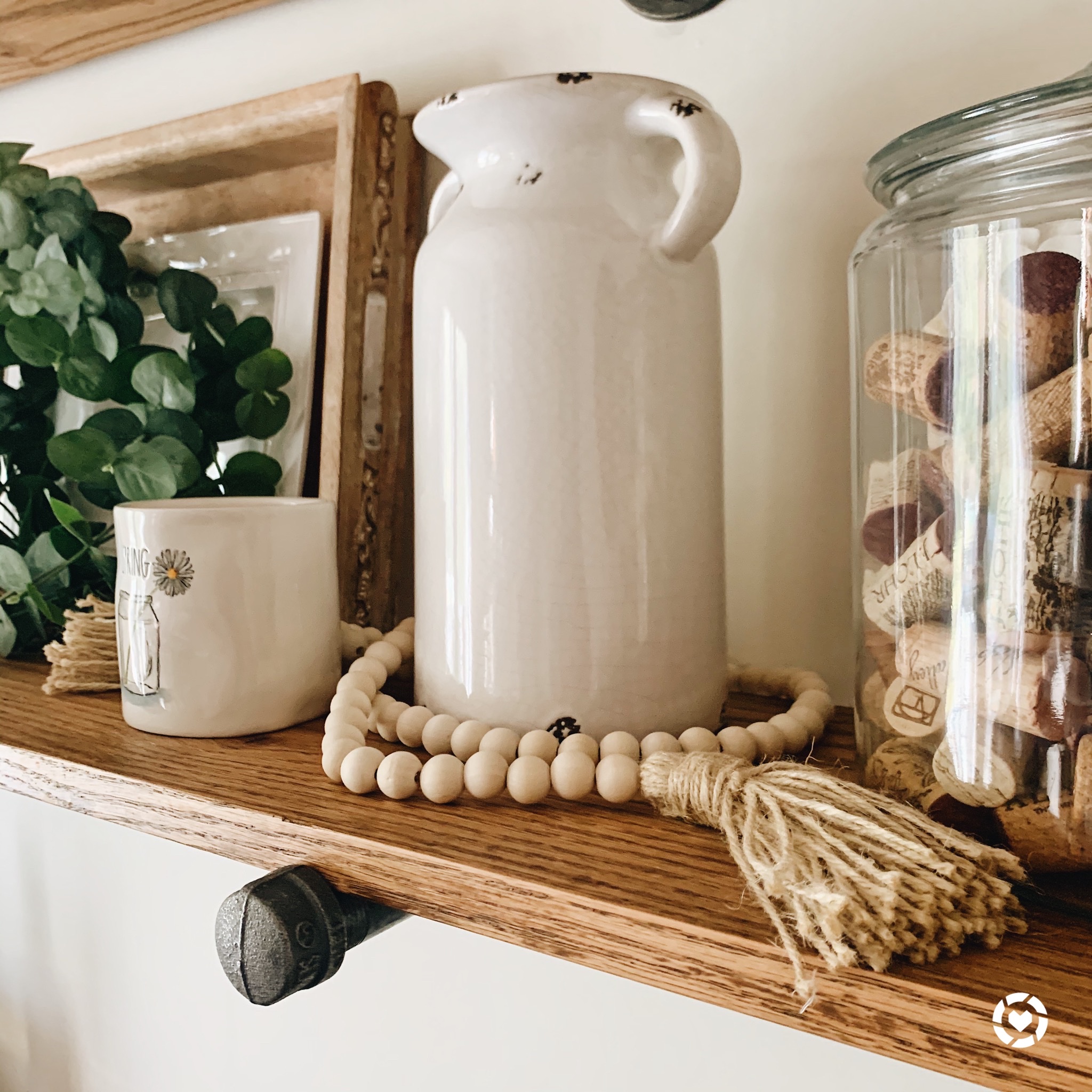 Vintage milk jug vase and wooden bead garland - farmhouse dining room decor essentials! | ourlittlehomestyle.com